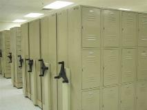 During the booking process, inmates are assigned a property locker. Their personal belongings are inventoried and kept secure in these lockers until the inmate is released.