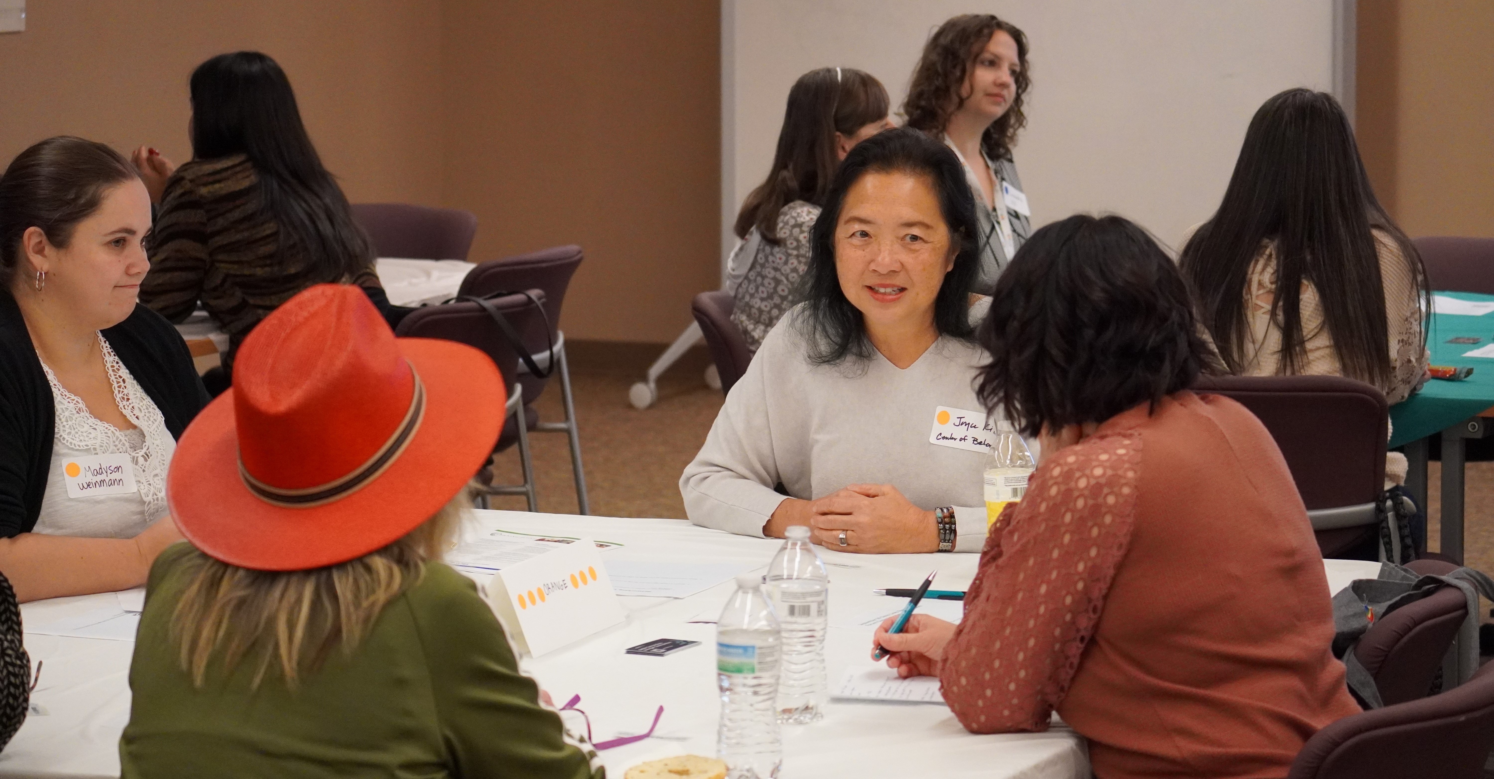 Participants interacting at a table at the 2025 Davis Links Networking Event